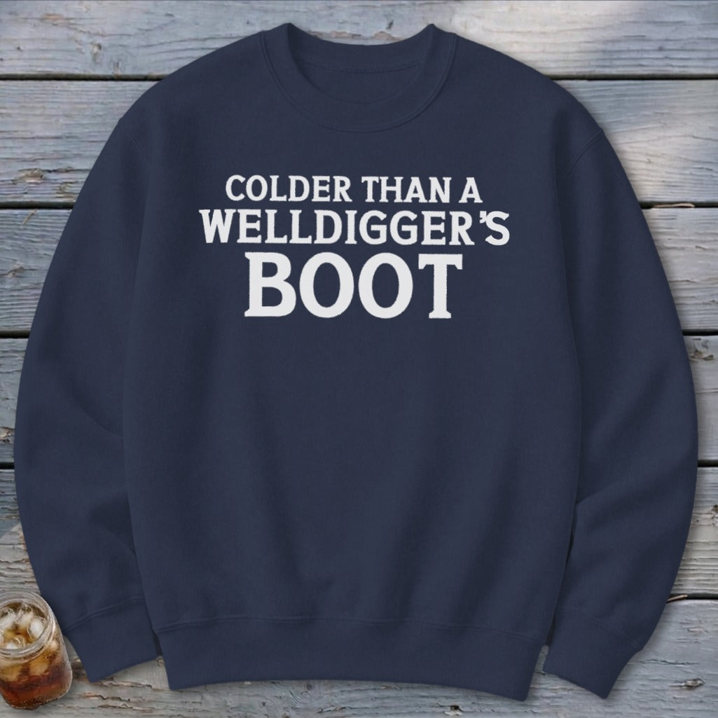 Navy sweatshirt with white text: "Colder Than A Welldigger's Boot".