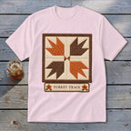 Pink t-shirt with a "Turkey Track" quilt block design and text.