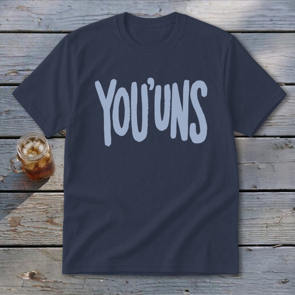 Navy t-shirt with light blue "YOU' UNS" text, next to a glass of iced tea.