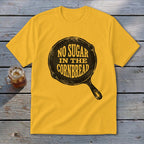 Yellow t-shirt with "NO SUGAR IN THE CORNBREAD" text inside a skillet graphic.