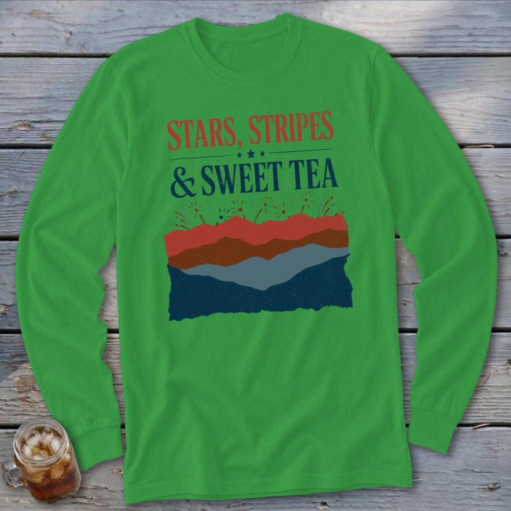 Kelly green long-sleeved shirt with graphic text reading STARS, STRIPES & SWEET TEA over abstract mountain layers.