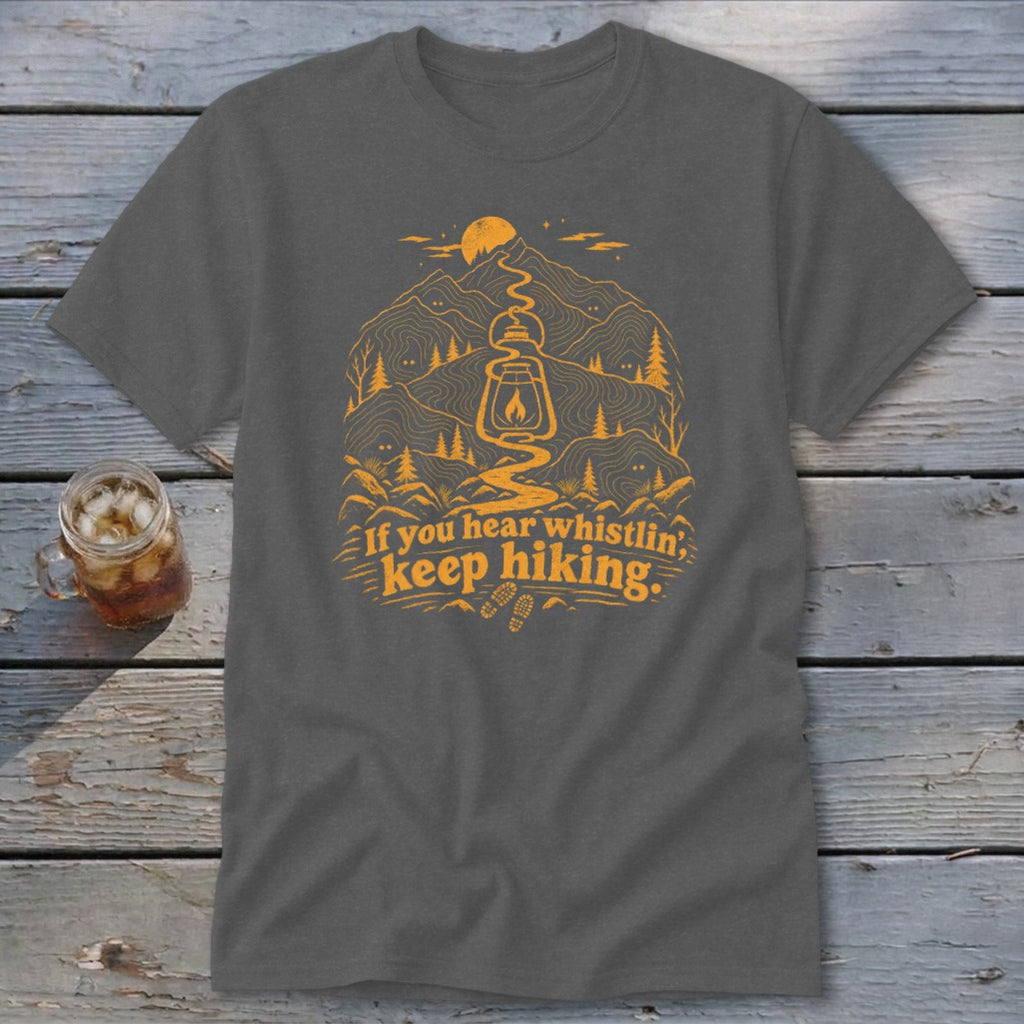 Dark grey t-shirt with orange mountain and lantern graphic, "If you hear whistlin', keep hiking."