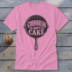Pink t-shirt with cast iron skillet graphic and text "Cornbread ain't cake."