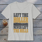 Light grey v-neck t-shirt with "Left the Holler Never Left the Hills" text and mountain graphic.