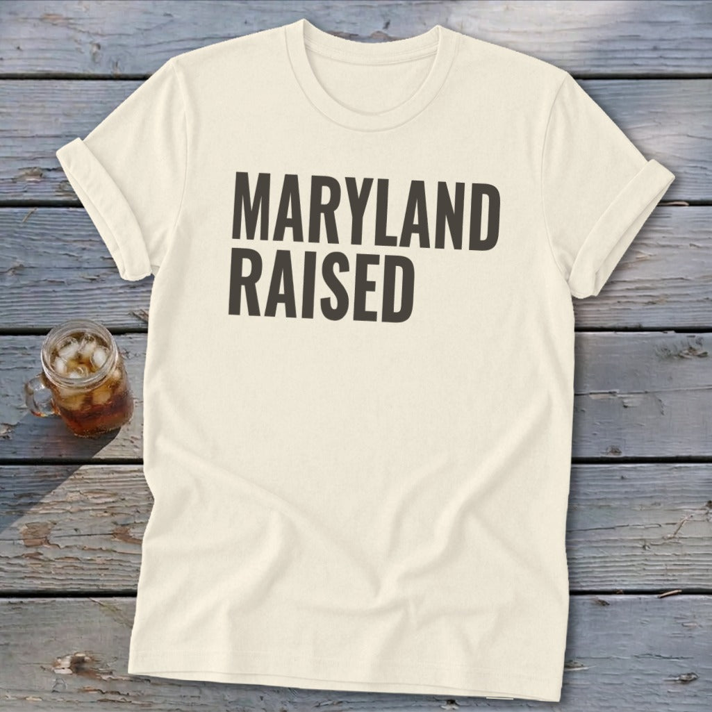 Cream t-shirt with "Maryland Raised" in bold black text.