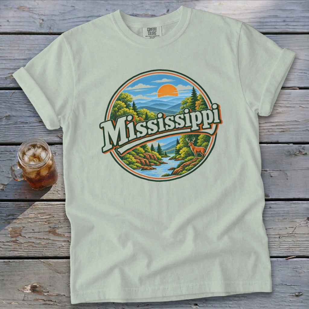 T-shirt with a circular graphic featuring the word "Mississippi" over a scenic landscape and deer.