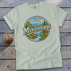 T-shirt with a circular graphic featuring the word "Mississippi" over a scenic landscape and deer.
