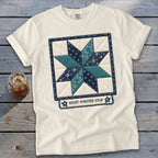 Cream t-shirt with an eight-pointed star quilt block design and text.