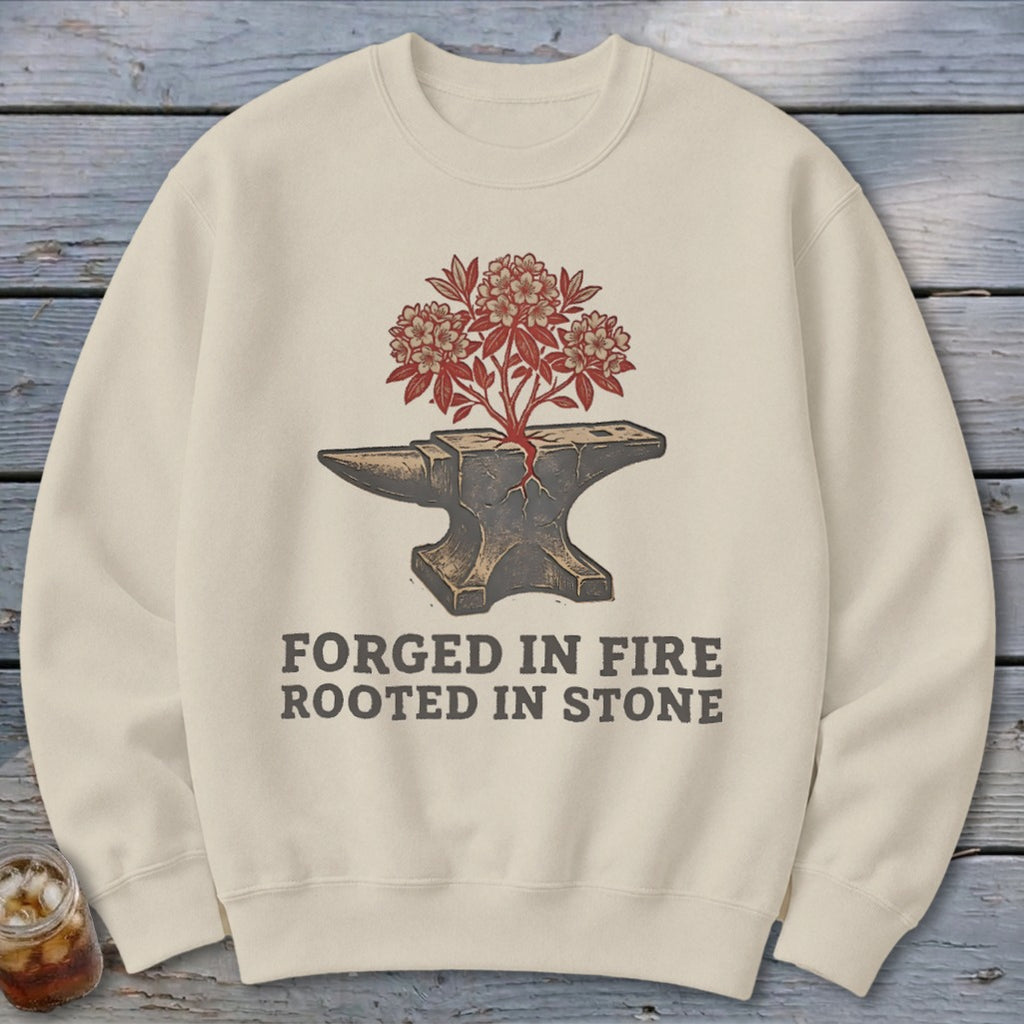 Cream sweatshirt with anvil graphic and text "FORGED IN FIRE ROOTED IN STONE".