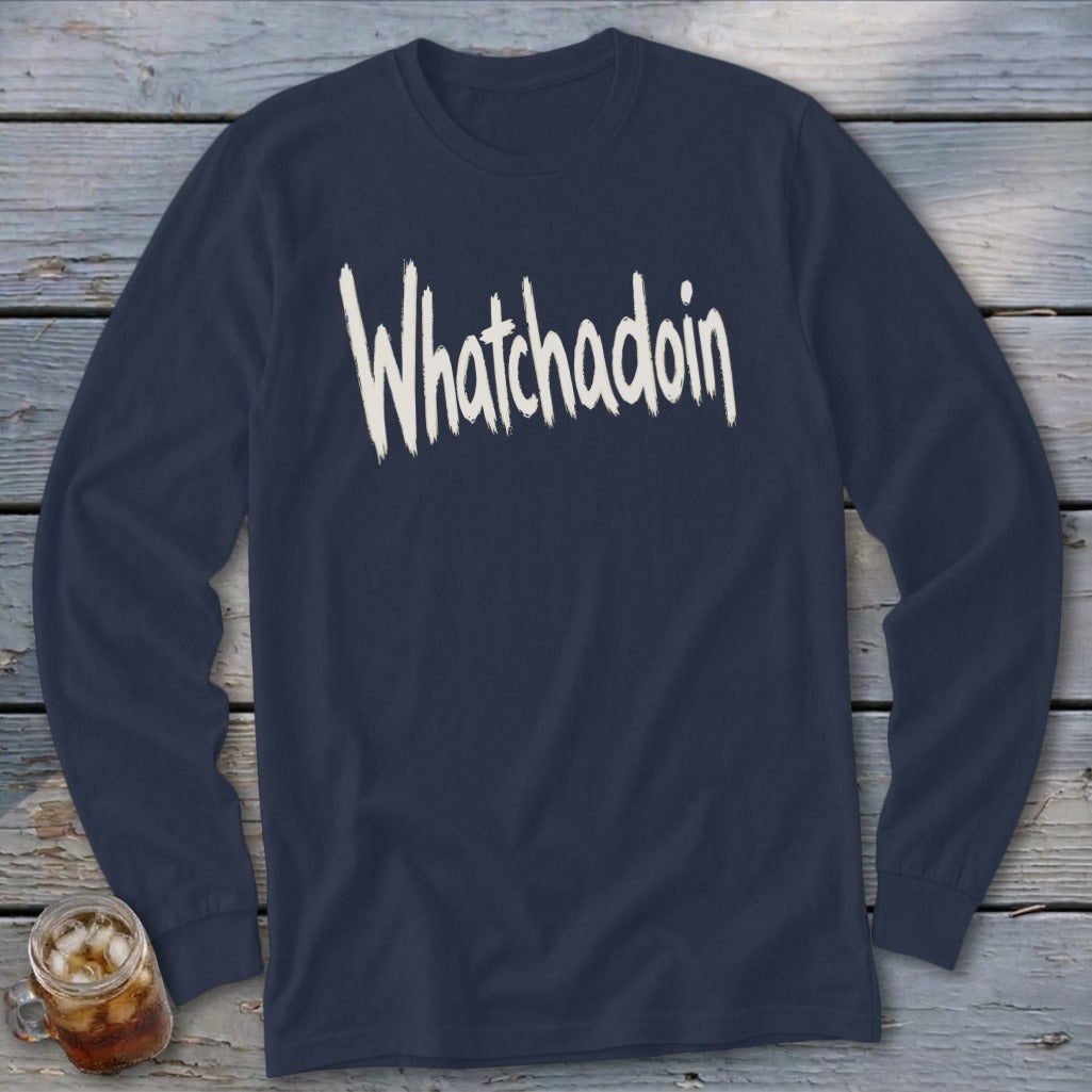 Navy long sleeve shirt with "Whatchadoin" text in distressed white lettering.