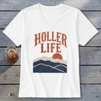 A white V-neck t-shirt featuring a retro graphic with the text HOLLER LIFE above mountain layers and a sun.