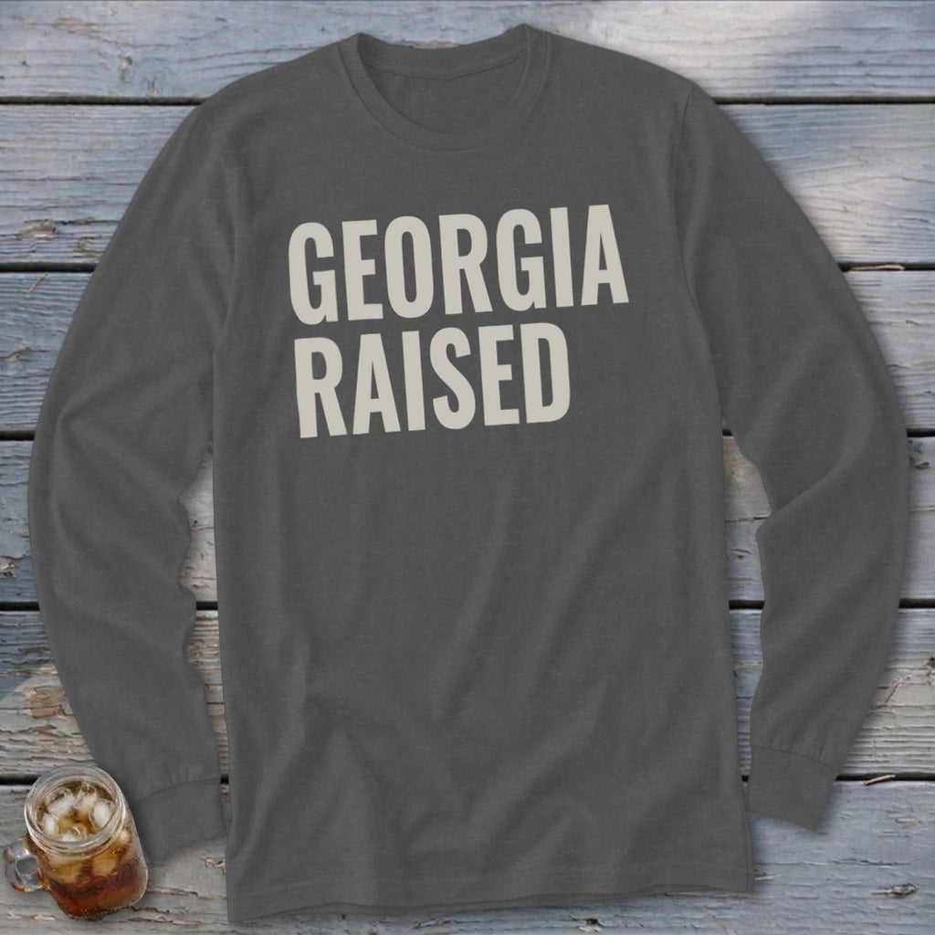 Dark grey long-sleeve t-shirt with "GEORGIA RAISED" text.