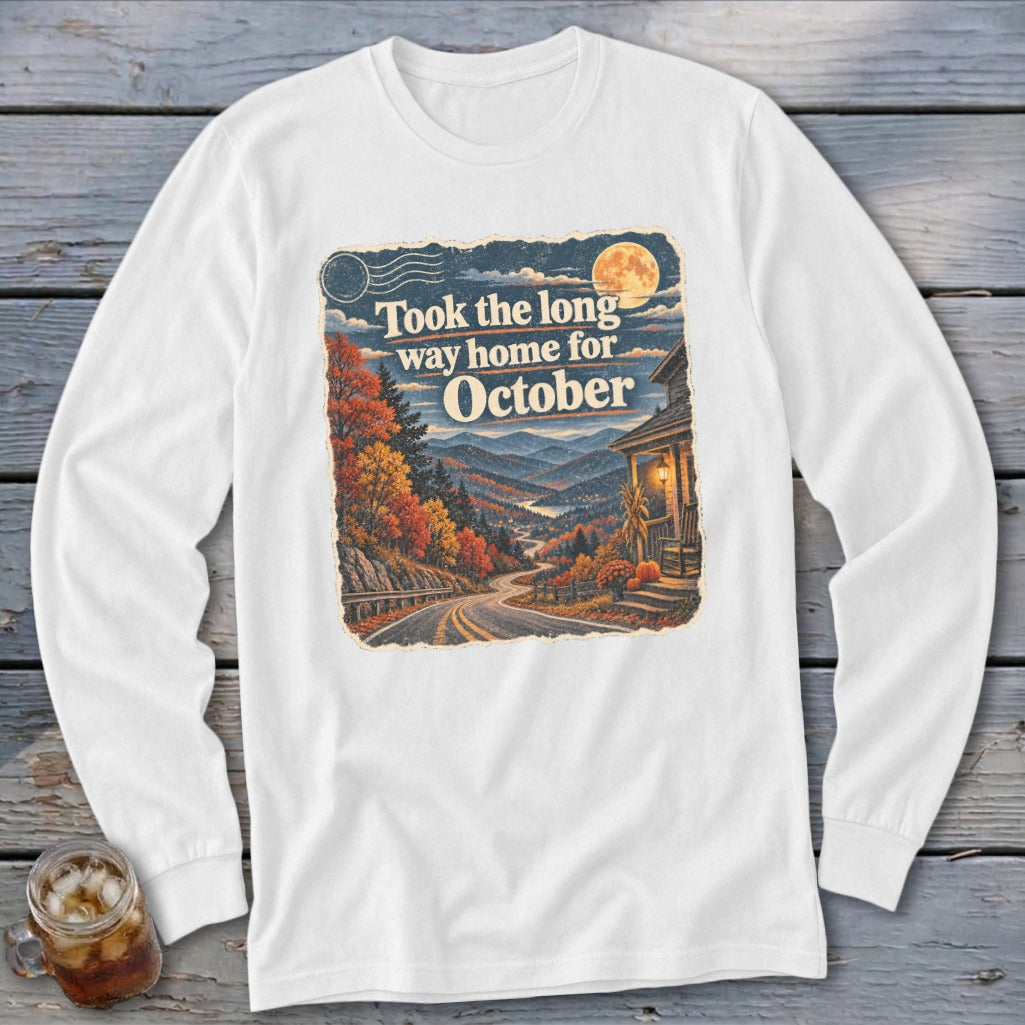 White long-sleeve shirt with fall mountain landscape and "Took the long way home for October" text.