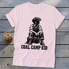 Pink t-shirt with black graphic of a boy in overalls and hat holding a bucket, "COAL CAMP KID" text.