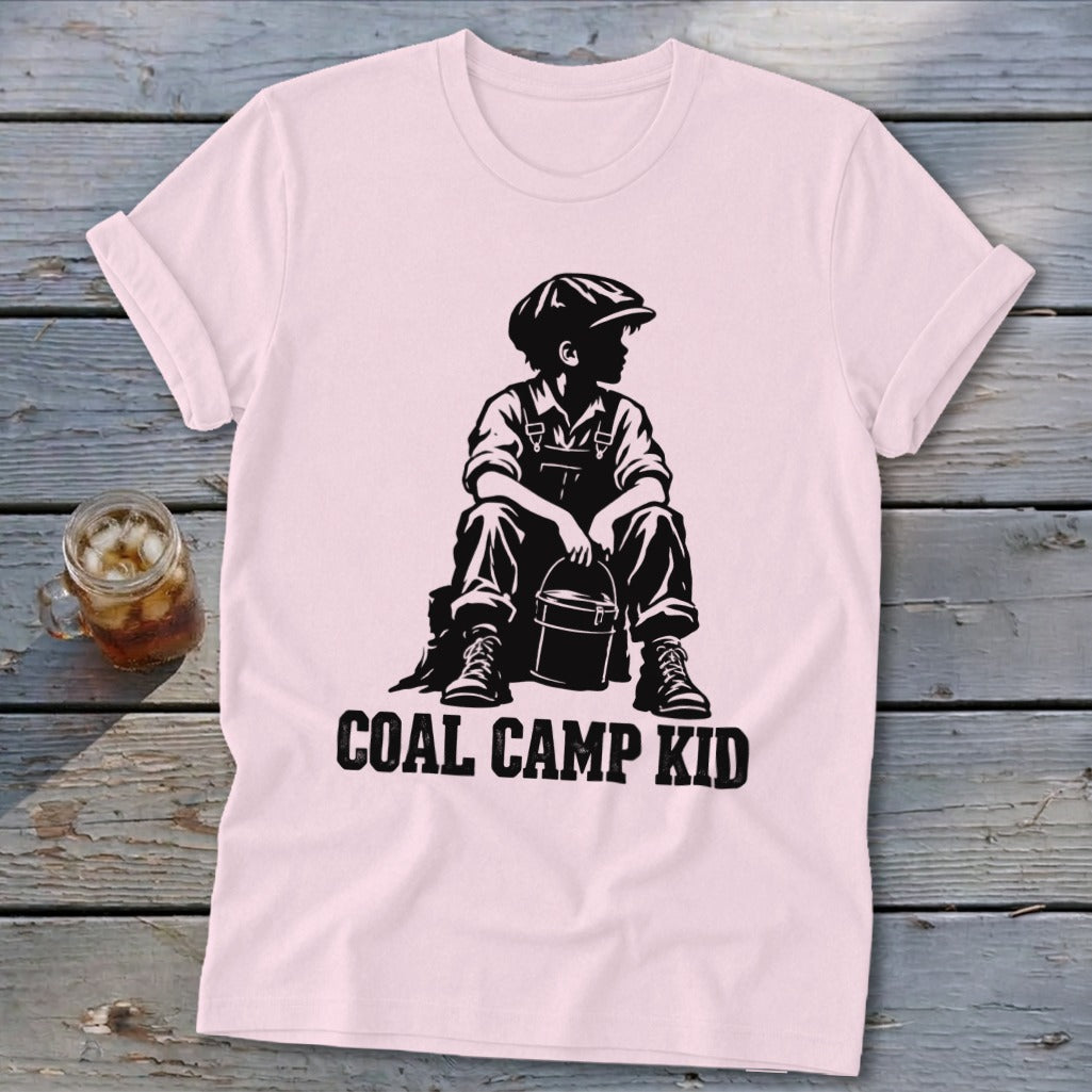 Pink t-shirt with black graphic of a boy in overalls and hat holding a bucket, "COAL CAMP KID" text.