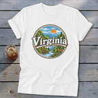 White t-shirt with a circular graphic of a Virginia mountain landscape at sunset.
