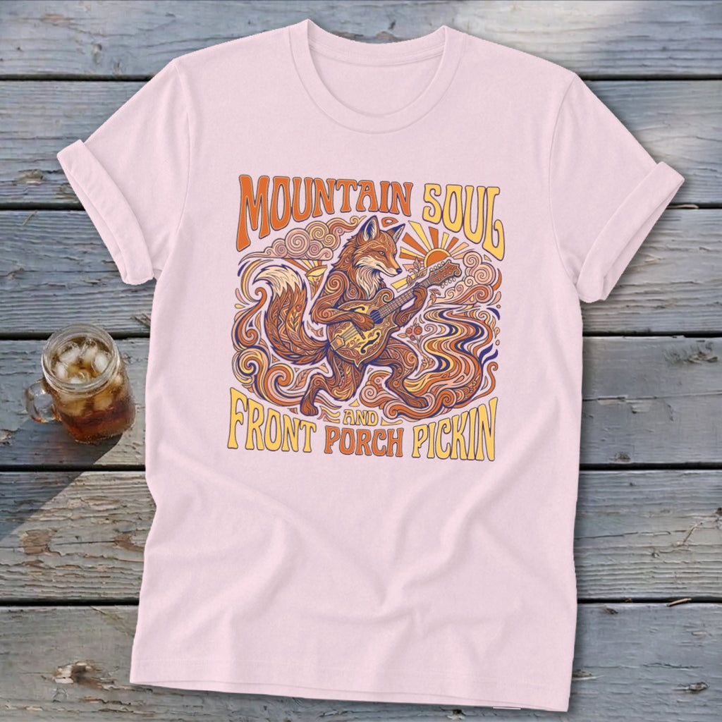 Pink t-shirt with a fox playing a guitar, "Mountain Soul" and "Front Porch Pickin'" text.