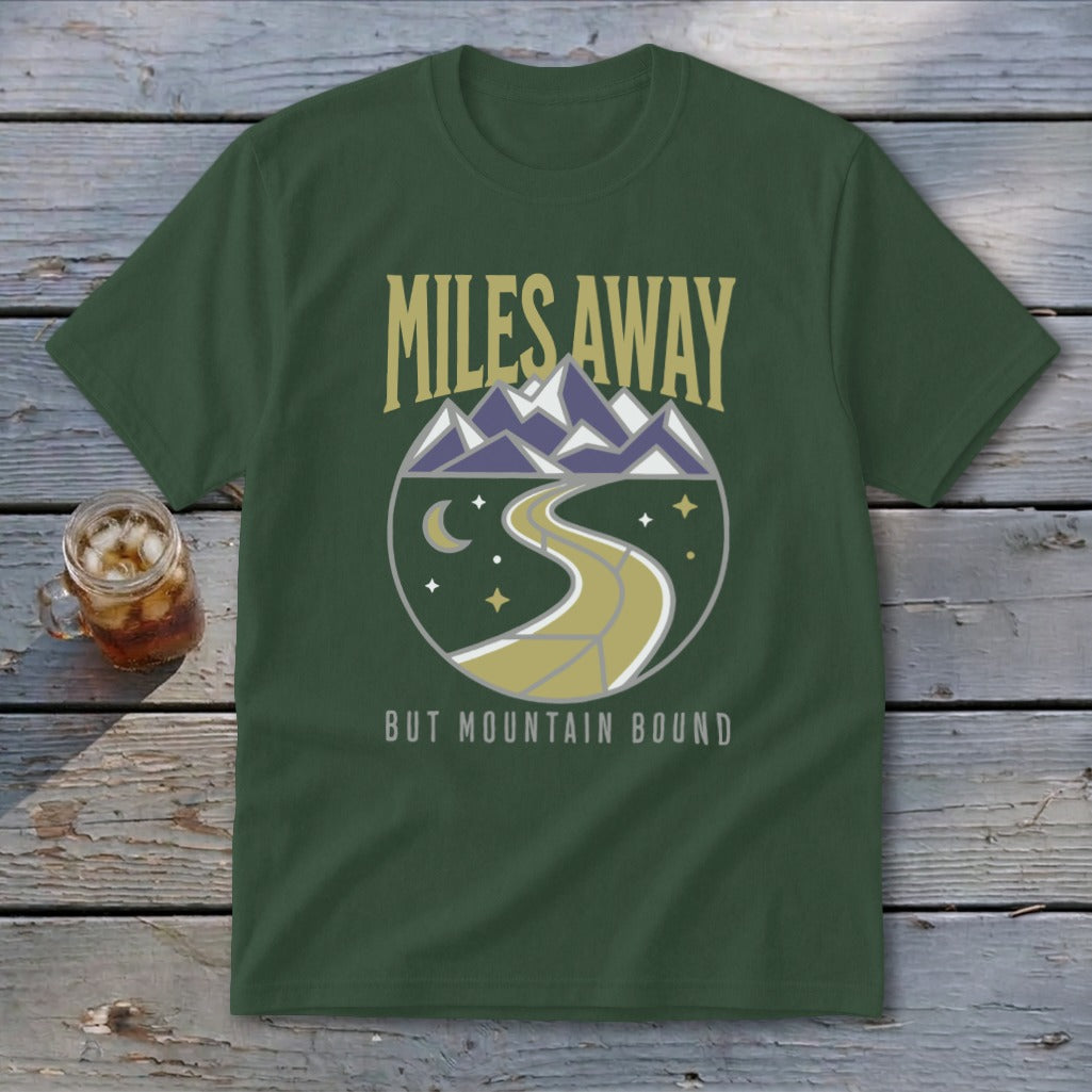 Green t-shirt with "Miles Away But Mountain Bound" text and mountain road graphic.