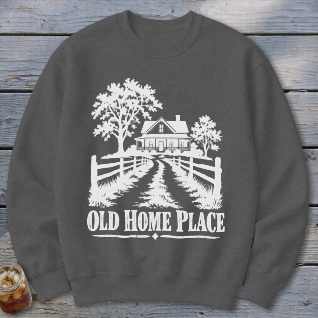 Dark grey sweatshirt with white graphic of a house, trees, fence, and "OLD HOME PLACE" text.
