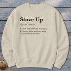 A cream-colored crewneck sweatshirt printed with black text defining the term Stove Up.