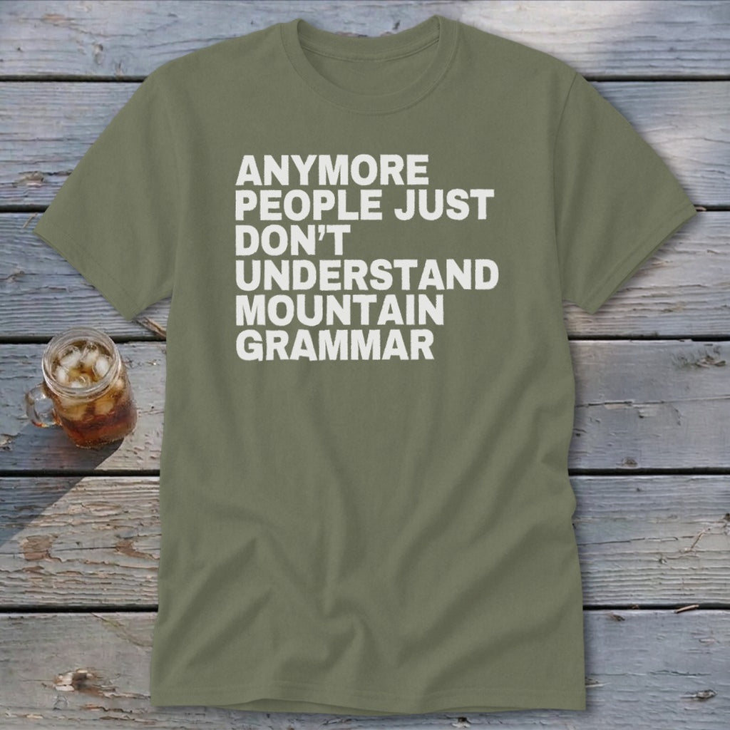 Olive green t-shirt with white text: "ANOMORE PEOPLE JUST DON'T UNDERSTAND MOUNTAIN GRAMMAR".
