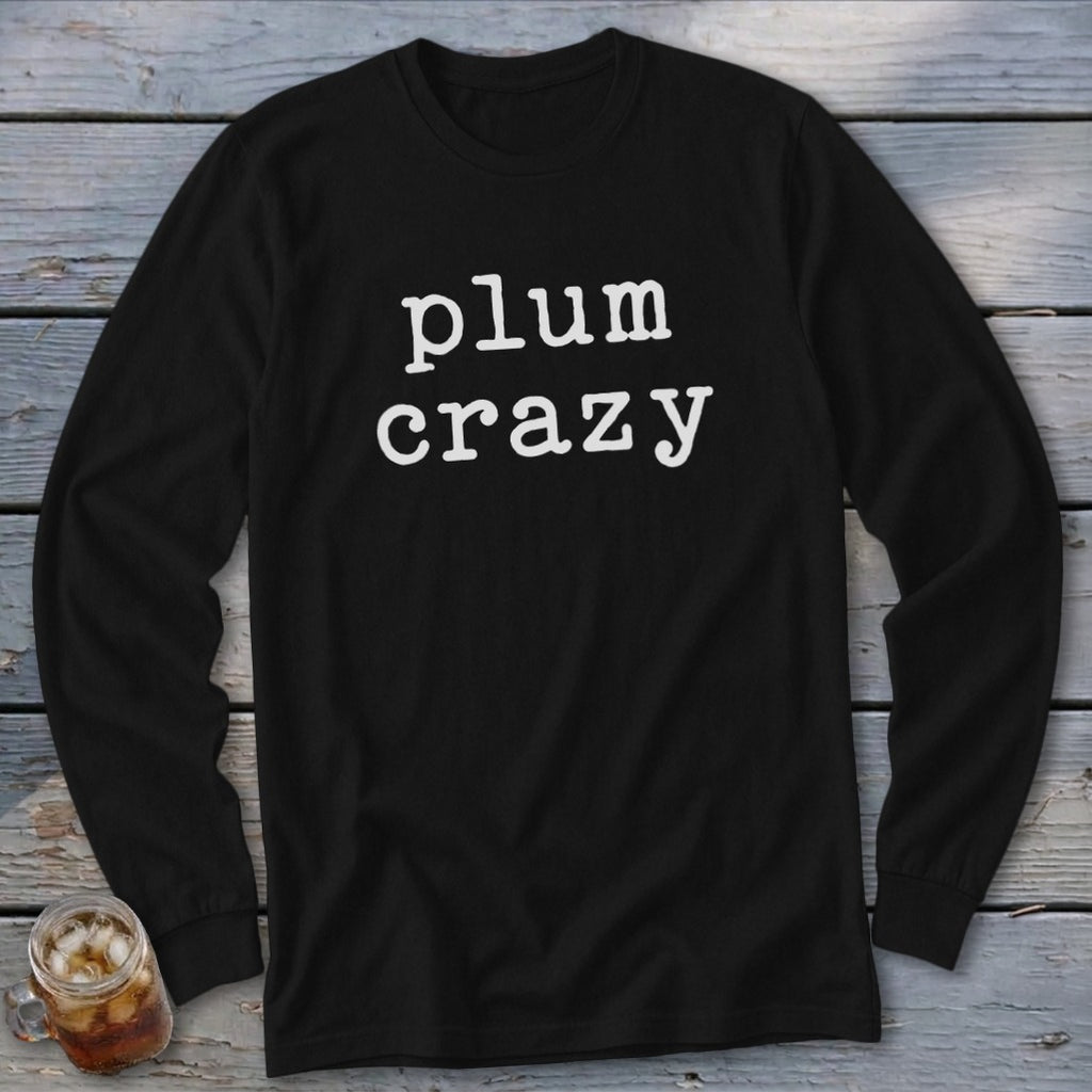 Black long sleeve shirt with "plum crazy" text in white serif font.