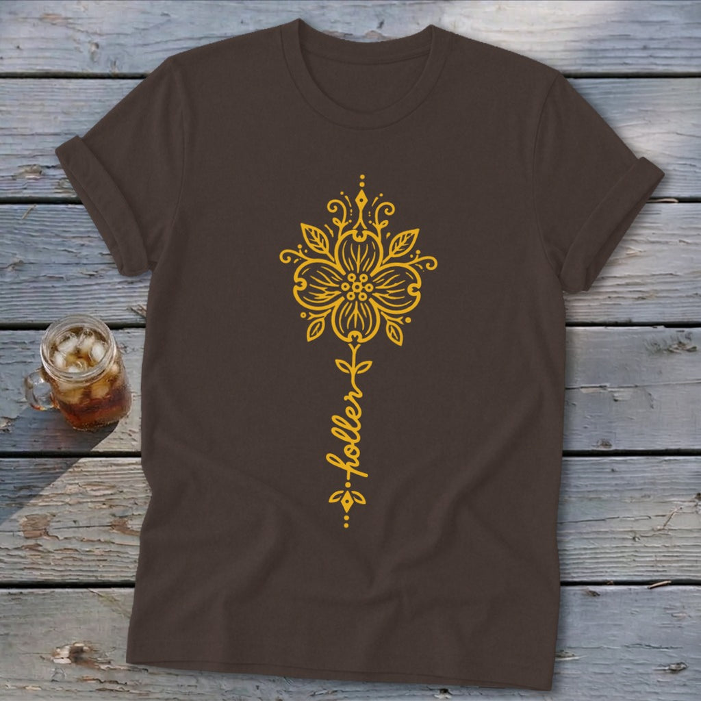 Brown t-shirt with a yellow floral design and the word "holler".
