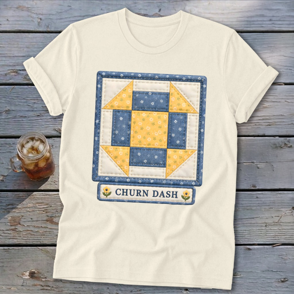 Cream t-shirt with a Churn Dash quilt block design and text.