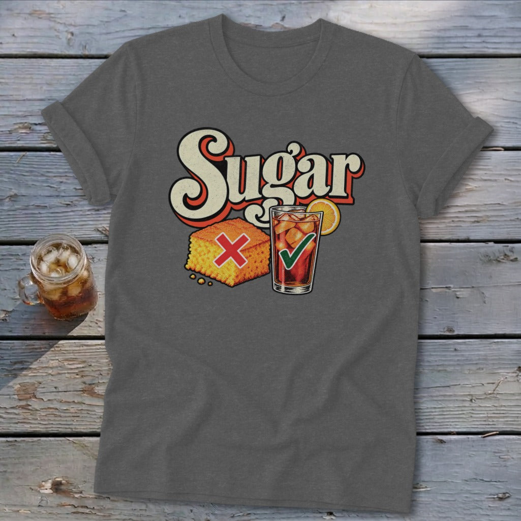 A dark gray t-shirt with retro text reading "Sugar", a cornbread square marked with a red X, and a glass of iced tea with a green checkmark.