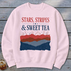 A light pink crewneck sweatshirt features distressed patriotic graphics and the text STARS STRIPES SWEET TEA.