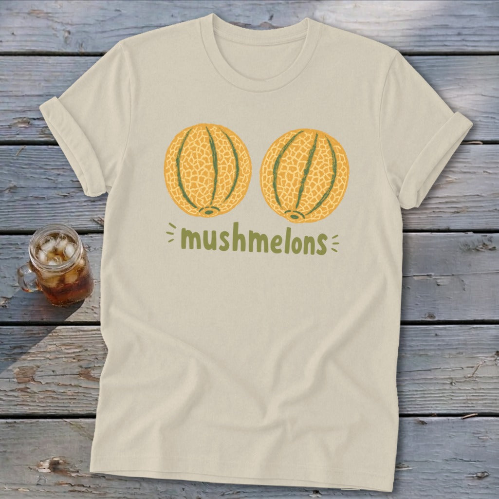 Light beige t-shirt with "mushmelons" text and two illustrated melons.