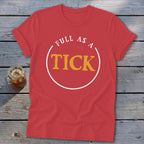 Red t-shirt with white circle containing yellow text "FULL AS A TICK".