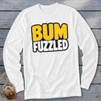 A white long-sleeve t-shirt features bold text reading BUM FUZZLED on the chest.
