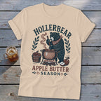 Bear making apple butter with text "Hollerbear Apple Butter Season."
