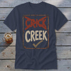 Navy t-shirt with distressed "CRICK CREEK" text and a checkmark.