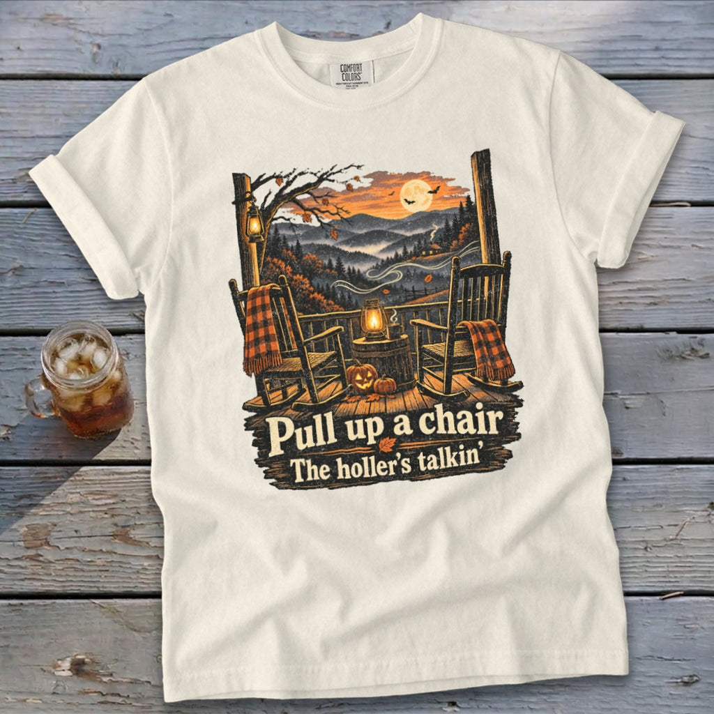 T-shirt with rocking chairs, autumn mountains, moon, and text "Pull up a chair The holler's talkin".