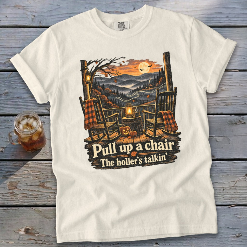 T-shirt with rocking chairs, autumn mountains, moon, and text "Pull up a chair The holler's talkin".