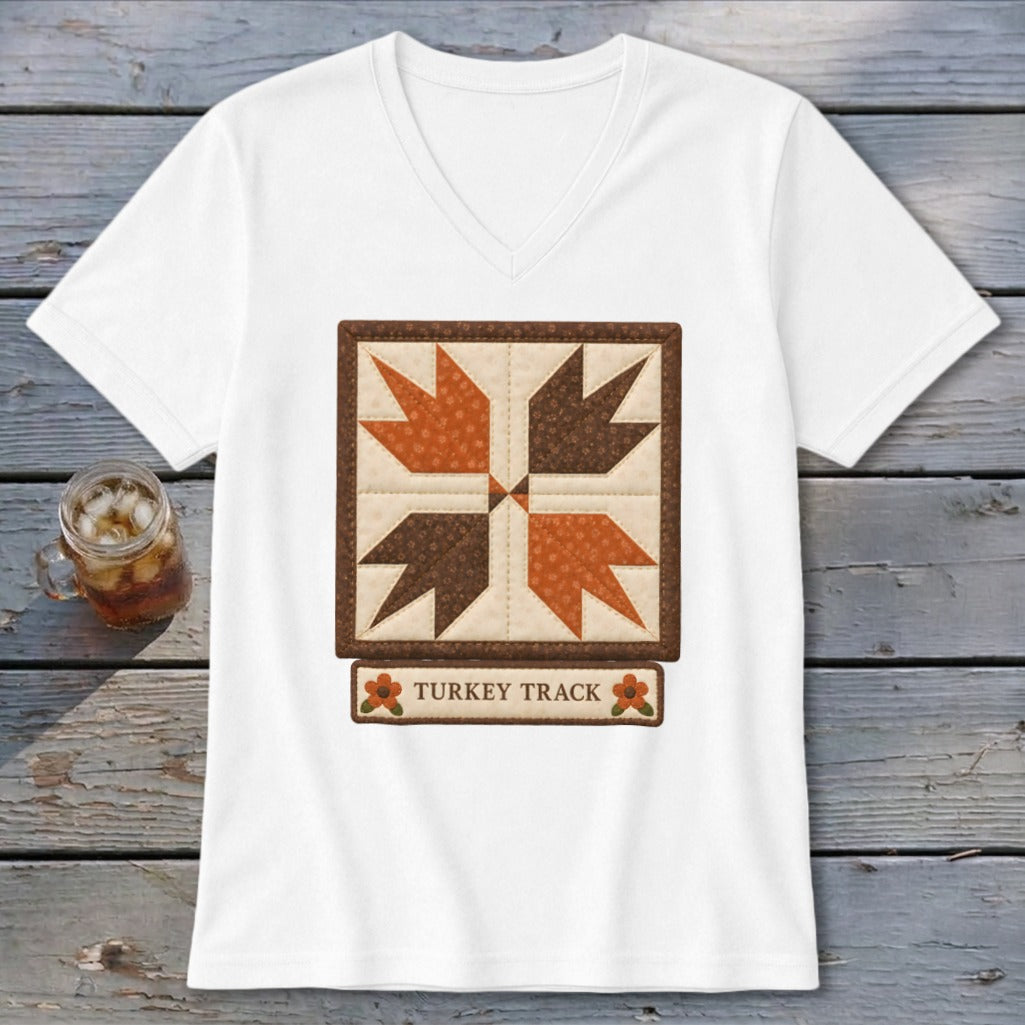 White t-shirt with a square quilt block design and "TURKEY TRACK" text.
