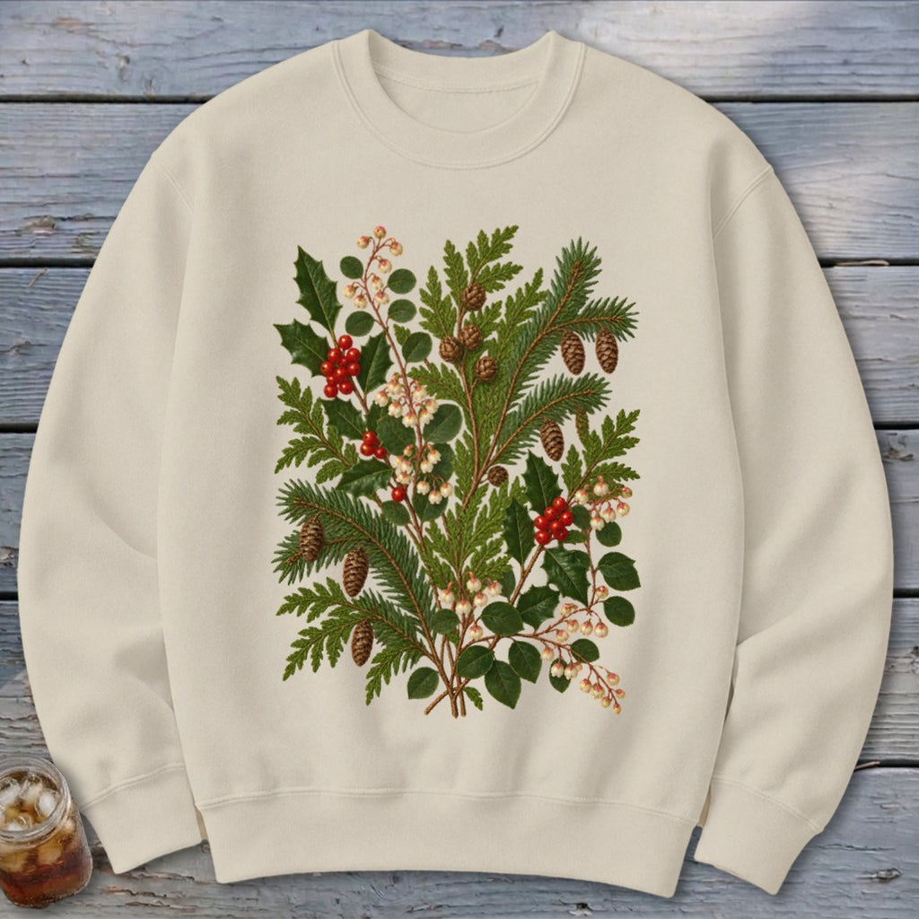 A cream crewneck sweatshirt featuring a vintage botanical illustration of pine branches, berries, and pinecones on the chest.