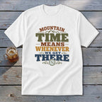 White t-shirt with text "Mountain Time Means Whenever We Get There" and a clock graphic.