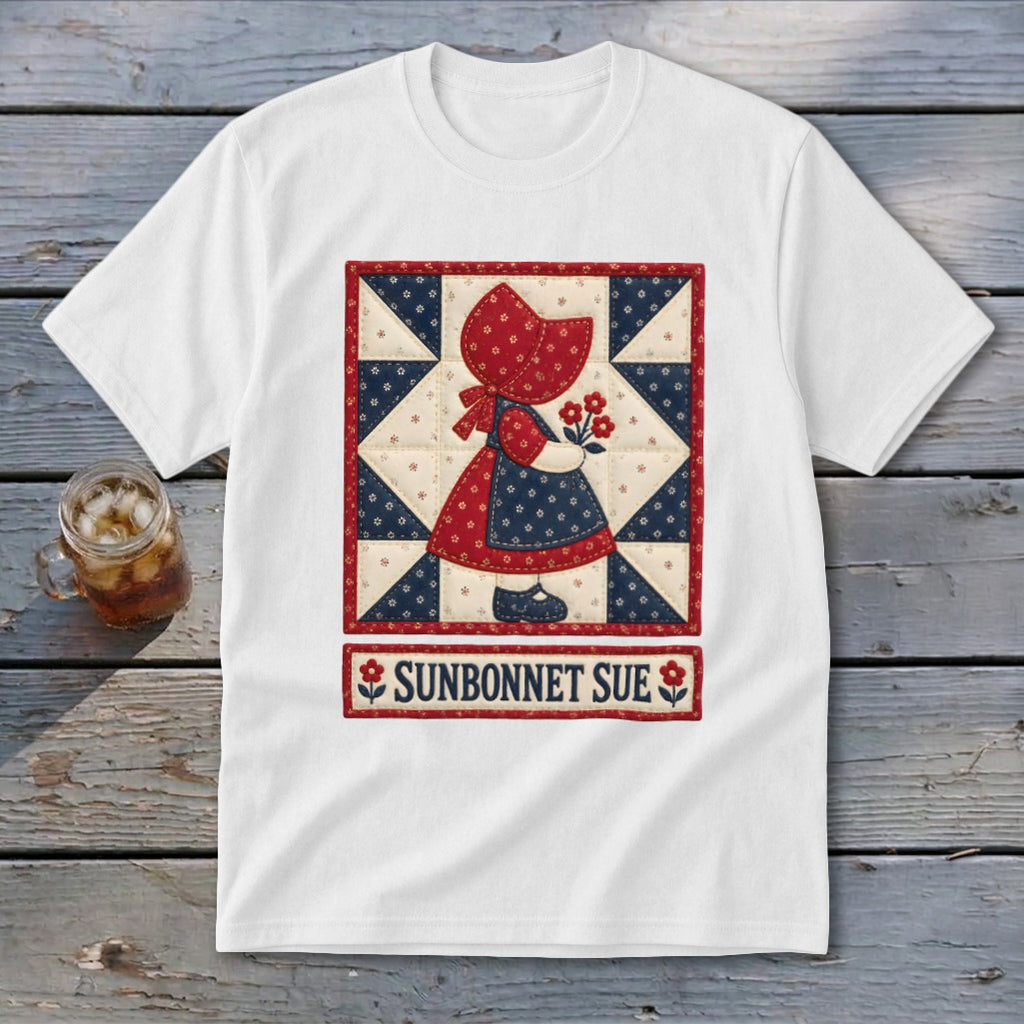White t-shirt featuring a Sunbonnet Sue quilt design with flowers and text.