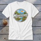 White t-shirt featuring a circular graphic of a Mississippi landscape with text.