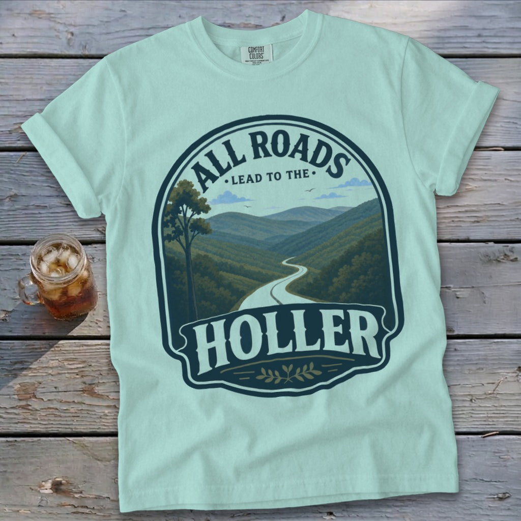 Pale aqua Comfort Colors t-shirt with "All Roads Lead to the Holler" landscape graphic.
