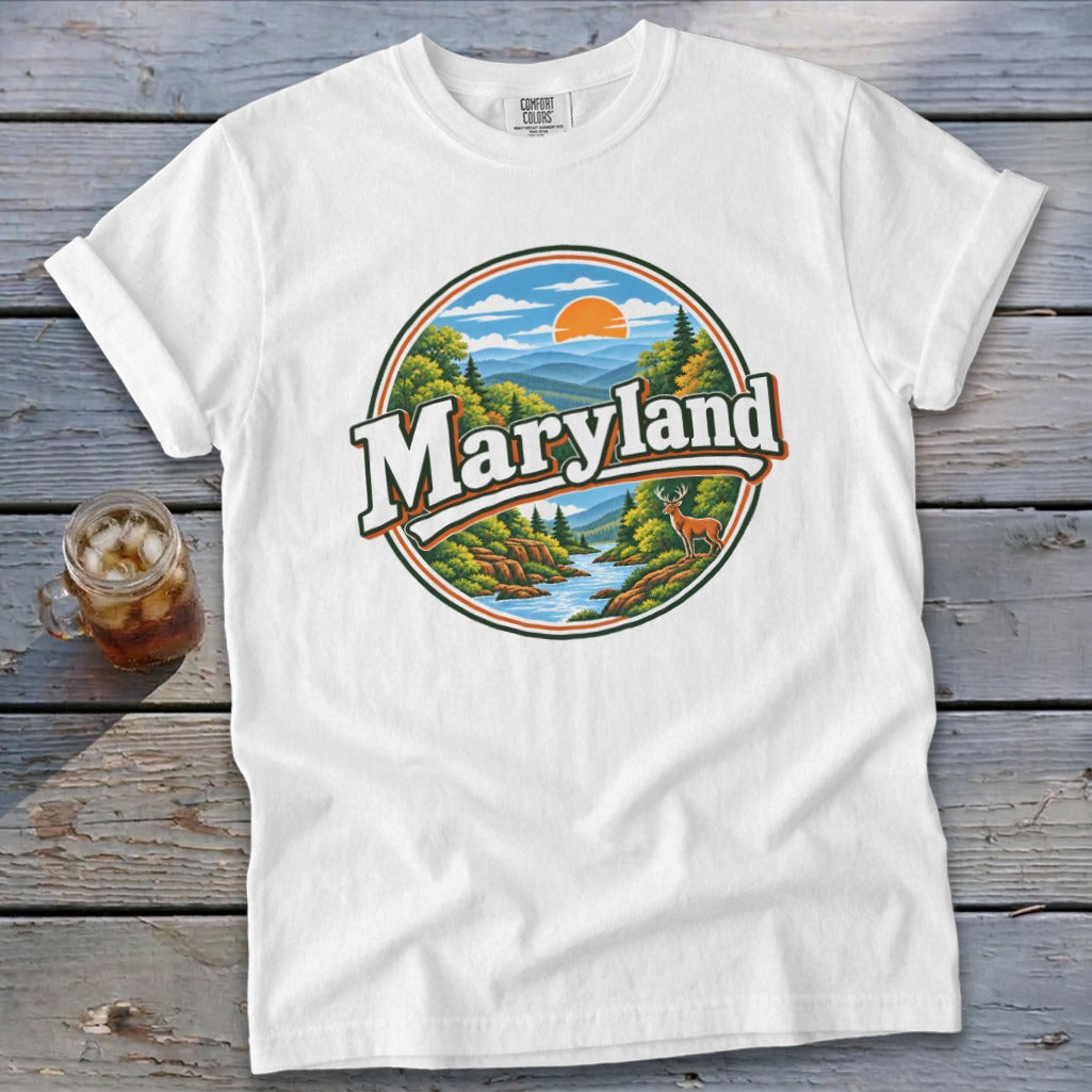 White t-shirt with a circular Maryland graphic featuring a river, mountains, deer, and trees.