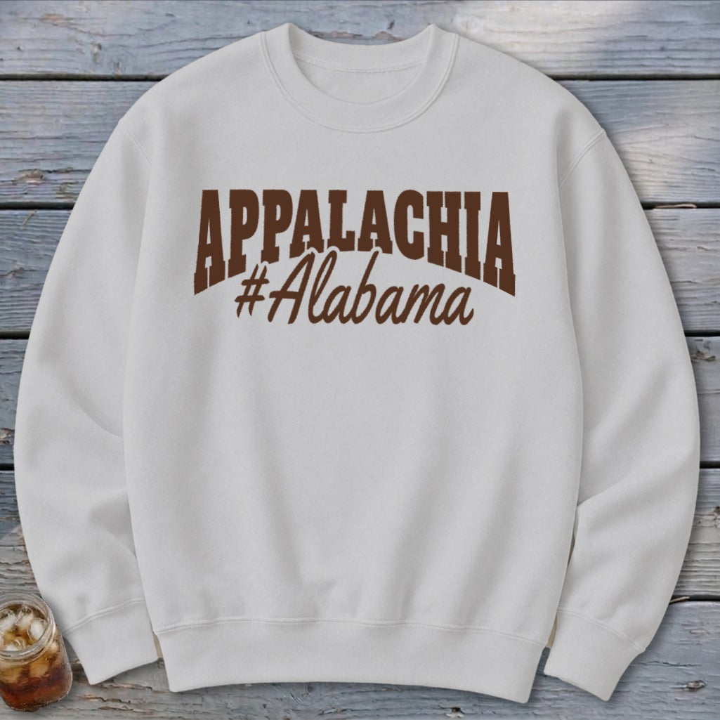 White sweatshirt with brown "Appalachia #Alabama" text on chest.