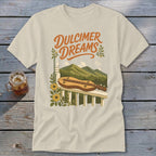 T-shirt with "Dulcimer Dreams" text and a dulcimer on a porch railing with mountains.