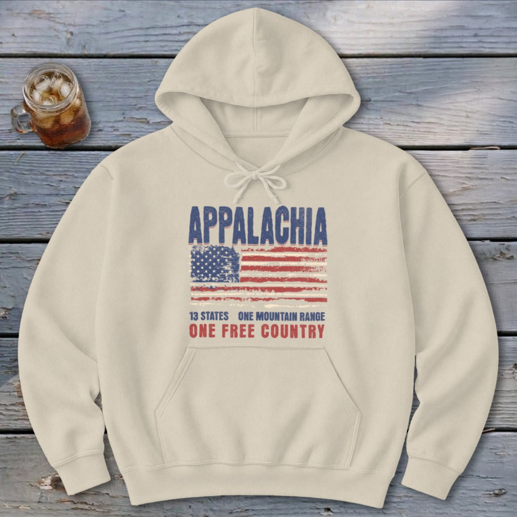 Cream-colored hooded sweatshirt with a distressed graphic featuring the word Appalachia, an American flag, and patriotic text.