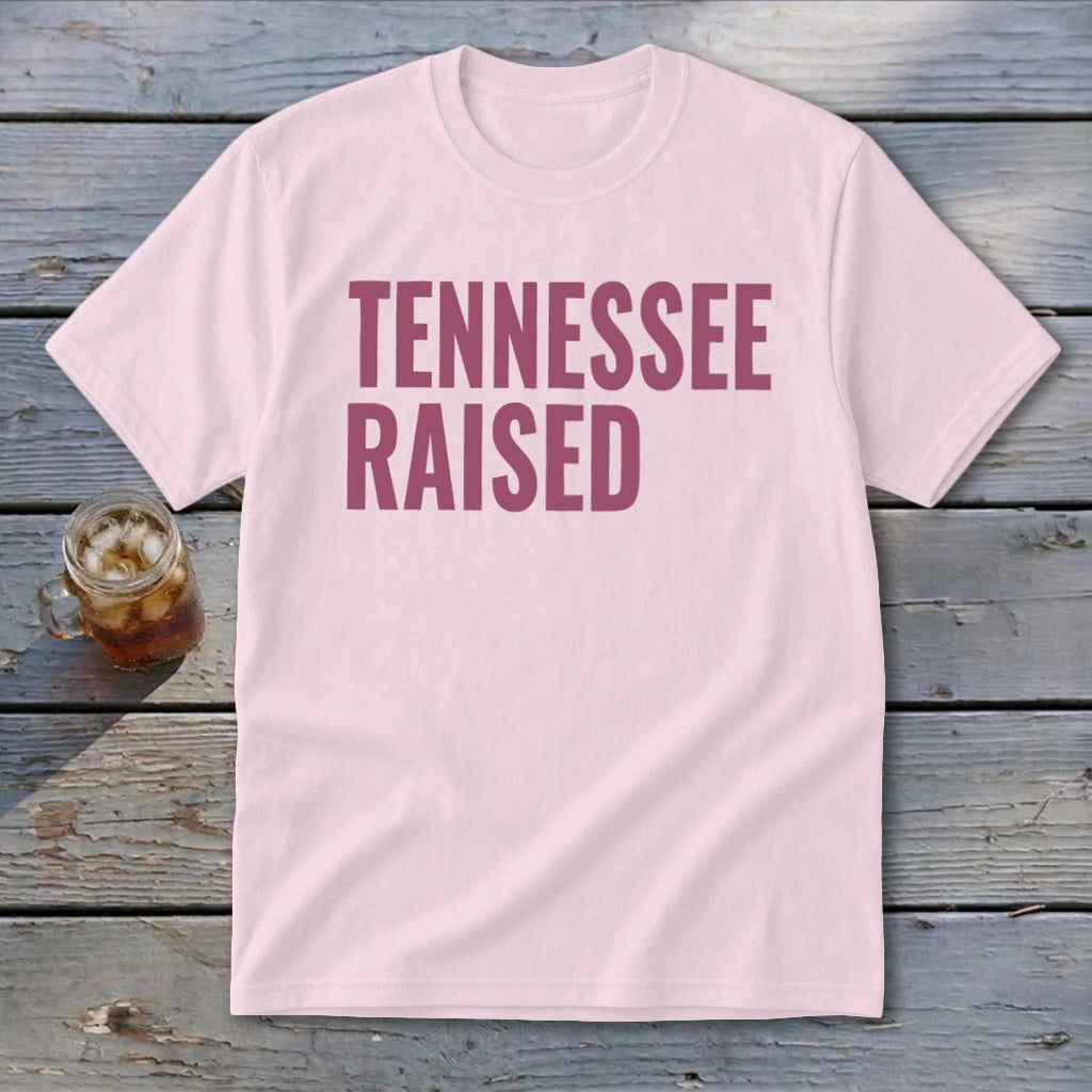 Light pink t-shirt with "TENNESSEE RAISED" text in maroon.