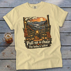 Cream t-shirt with a porch scene, rocking chairs, pumpkins, and text "Pull up a chair, The holler's talkin'".