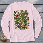 Pink long-sleeve t-shirt with a botanical print of pine, holly, and pinecones.
